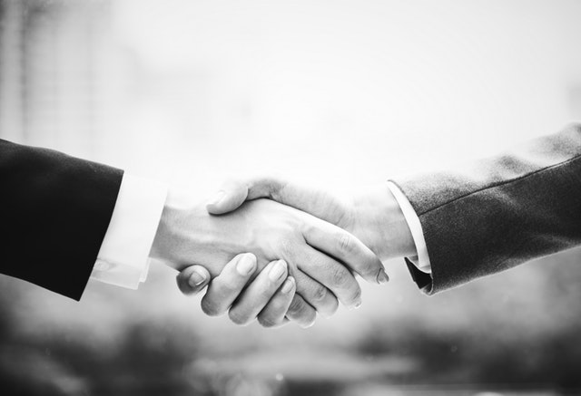 An image of two people shaking hands.