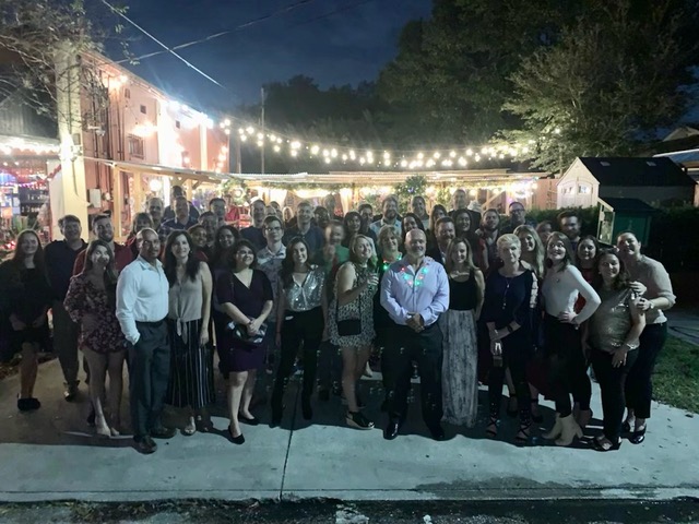 A group of employees posing for a photo.